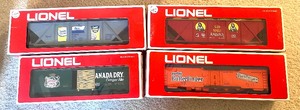 lot 28 image: Lionel Red Box Freight Train Cars including Canada Dry Box Car 6-7802