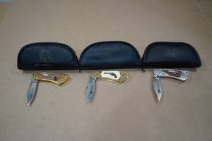 lot 84 image: 3 Franklin Mint Colt Pocket Knives -Single Action Army Peacemaker, 1955 Python .357 Magnum, 1911 Automatic