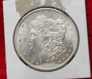 lot 209 image: 1881 $1 MORGAN DOLLAR 90% SILVER