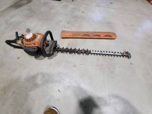 lot 43 image: Stihl Gasoline Hedge Trimmer with Protective Cover - non running
