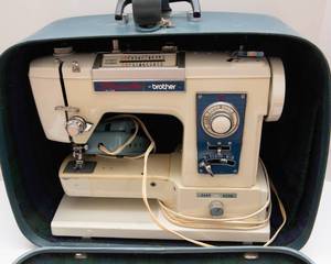 lot 20 image: Pacesetter XL702 by Brother Vintage Sewing Machine with Case & Extender Plate