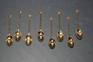 lot 89 image: Set of 8 Gold Tone DemitasseCoffee Spoons  Teapot Design