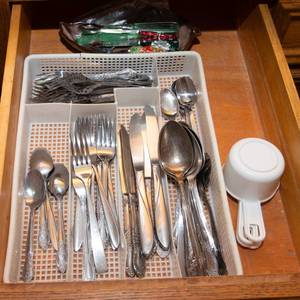 lot 104 image: Contents of Drawer  Flatware, Measuring Cups, and More