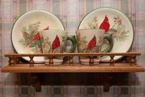 lot 110 image: Cardinal Collection  Two Plates, Two Mugs, and Display Shelf
