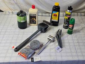 lot 25 image: 1 lb Propane, Lighter Fluid, Tiki Torch Fuel, Grill Brush and More