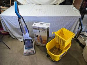 lot 91 image: Lot of Cleaning Equipment Hoover Carpet Cleaner, Shark Steam Mop, and Libman Mop Bucket