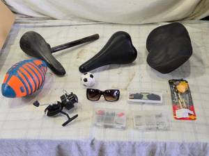 lot 183 image: Assorted Bicycle Seats, Sunglasses, Fishing Reel, and Sports Items