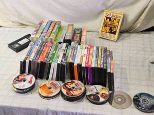 lot 196 image: DVDs and VHS Tapes Including Red Skelton and Various Movies - Loose DVDs Need Cleaning