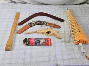 lot 210 image: Boomerangs, Wooden Gun, and Parasol