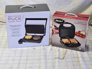 lot 232 image: Wolfgang Puck Panini Duet and Parini Electric Sandwich Maker Set