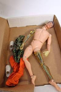 lot 182 image: Vintage Action Figure with Accessories - Includes Clothing and Shoes