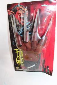 lot 192 image: Vintage Devil-Themed Claw Glove in Original Packaging