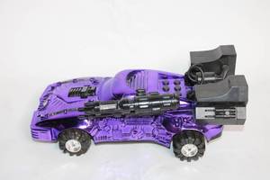 lot 226 image: Purple Metallic Toy Car with Dual Exhaust and Rocket Launchers