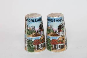 lot 241 image: Pair of New Orleans Themed Ceramic Salt and Pepper Shakers