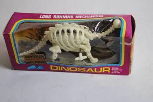 lot 251 image: Vintage Wind-Up Walking Dinosaur Skeleton Toy in Original Box