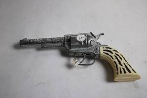 lot 292 image: Vintage Cap Gun with Ornate Details and Ivory-Look Handle