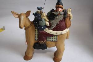 lot 316 image: Folk Art Santa Claus Riding a Mule Figurine