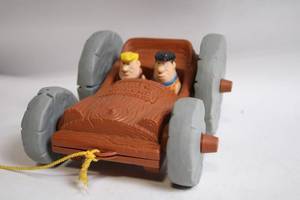 lot 340 image: Fred Flintstone Pull Cord Toy Car