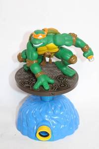 lot 375 image: 1990s Teenage Mutant Ninja Turtles Michelangelo Figure on Interactive Base