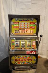lot 521 image: Vintage Bounty Slot Machine with Cherry Wood Finish