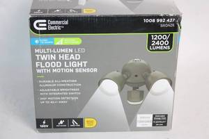lot 213 image: Commercial Electric LED Twin Head Flood Light with Motion Sensor