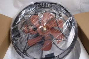 lot 485 image: Ceiling Light Fixture with Black Iron Finish and Amber Glass