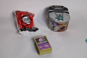 lot 395 image: Pokemon Collectible Card Set with Tin and Burger King Toy