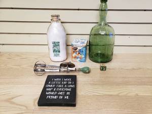 lot 20 image: 2 Glass bottles, 1 Neato Marbles tin no marbles, 1 Hand mixed and 1 wall hanging sign