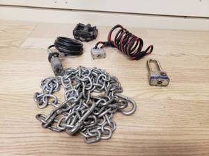 lot 77 image: Bike Lock cables, locks and bike pedal. No Keys