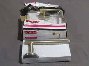 lot 24-113 image: Mixed Lot of Delta Trinsic Single Post Toilet Paper Holder and  Open Towel Ring in Champagne Bronze