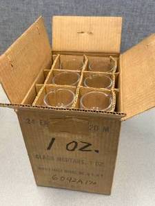 lot 19 image: 24 - Glass Mortors Mercer Glass 1oz.
