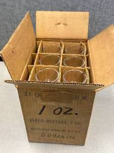 lot 21 image: 24 - Glass Mortors Mercer Glass 1oz.