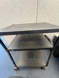 lot 46 image: Metal Utility Cart, With Plug in on side, and wheels.