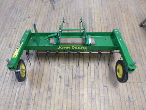 lot 28 image: John Deere Tow-Behind Dethatcher