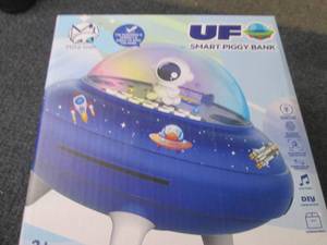 lot 93 image: UFO Smart Piggy Bank...