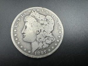 lot 51 image: 1897 O Mid Grade Morgan Dollar