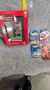lot 55 image: Tiger Woods Framed Photo and 4 Hot Wheel Cars