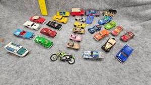 lot 63 image: Several Hot Wheels, Matchbox, and Ertl Cars