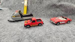 lot 67 image: Tonka Ski Doo Snowmobile, and Tootsie Toy Trucks