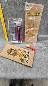 lot 78 image: Garfield Lunch BagsGarfield Pez DispenserBugs Bunny Pen Set