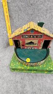 lot 87 image: 1953 Mattel Farmer in the Dell Music Maker Toy
