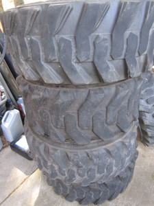 lot 8 image: Four BKT Skidster Tires - Used