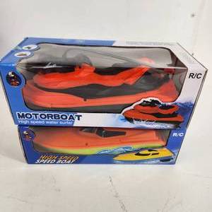 lot 44 image: Lot Of Two New RC Water Toys High Speed Boat And Jet SkiBoat Bright Colors
