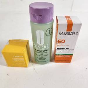 lot 56 image: Lot Of Three New Cosmetic Items LA Roche-Posay Clear Skin Sunscreen And Clinique Liquid Facial Soap Mild And Laneige Lip Sleeping Mask