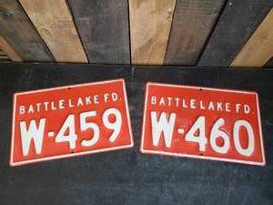 lot 26 image: 2 Retired Battle Lake Fire Number Signs Embossed