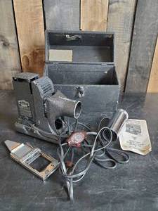 lot 28 image: Vintage Mini Slide  Projector Model RK With Case and Instructions