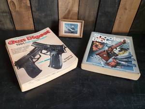 lot 43 image: 1991 Gun Digest 1986 Shooters Bible and Small Collectable Duck Print in frame