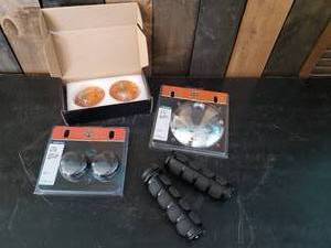 lot 83 image: Misc Harley Davidson Parts Bullet turn Signal Insert, touring Kit Cover, Grips and More