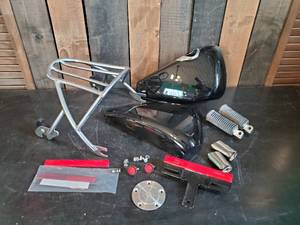 lot 90 image: Various Harley Davidson Parts, Luggage rack, Oil Filter Covers, and More