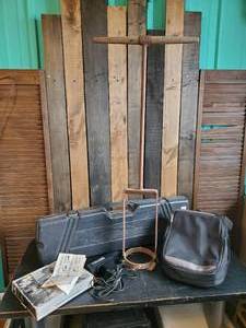 lot 116 image: Vintage Hand Held Ice Auger, WoodStream Bow Case, Garmin Case only, Napa Balkamp inductive Power Timing Light
